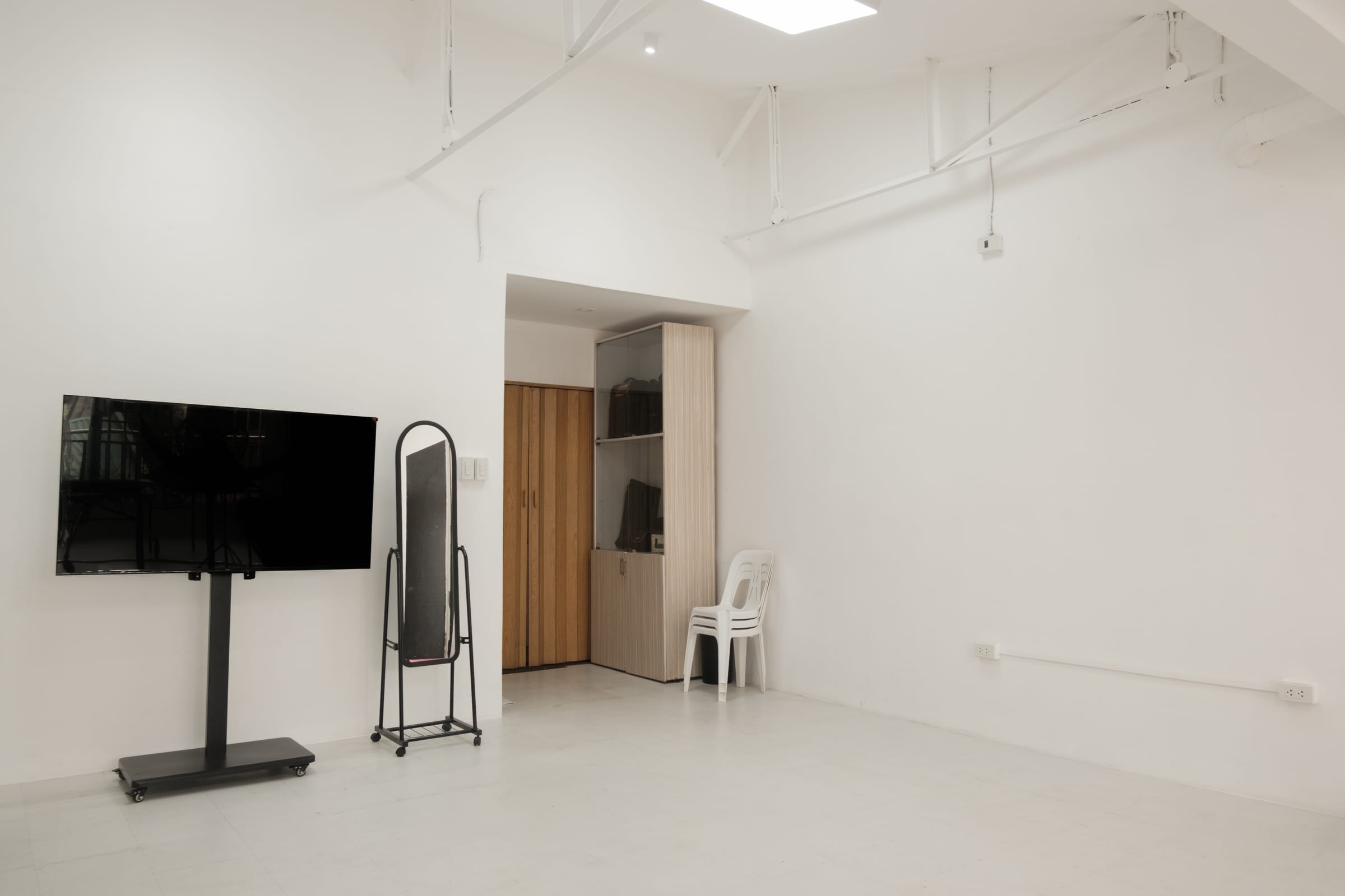 Studio with display screen and full-length mirror
